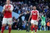 Arsenal's manager Mikel Arteta stands at the end of the English Premier League soccer match between Manchester City and and Arsenal, in Manchester, England, Sunday, April 19, 2026. (AP Photo/Dave Thompson)