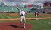 After he threw a ceremonial first pitch, former Boston Red Sox' player Jonny Gomes threw the baseball to the fans as he left the field before a baseball game against the Detroit Tigers, Monday, April 20, 2026 in Boston. (AP Photo/Jim Davis)