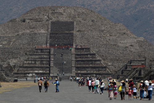 Visitors walk along the Avenue of the Dead toward the Pyramid of the Moon, in Teotihuacan, Mexico, Thursday, March 19, 2020. THE CANADIAN PRESS/AP - Rebecca Blackwell