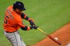 Houston Astros' Isaac Paredes hits a solo home run in the ninth inning of a baseball game against the Cleveland Guardians in Cleveland, Monday, April 20, 2026. (AP Photo/David Richard)