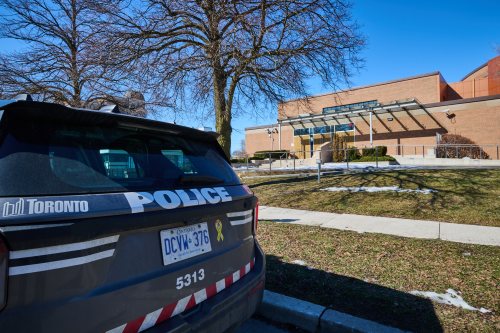 A police car remains parked outside Shaarei Shomayim synagogue in Toronto on Sunday, March 8, 2026. The synagogue was struck by gunfire overnight. THE CANADIAN PRESS/Sammy Kogan