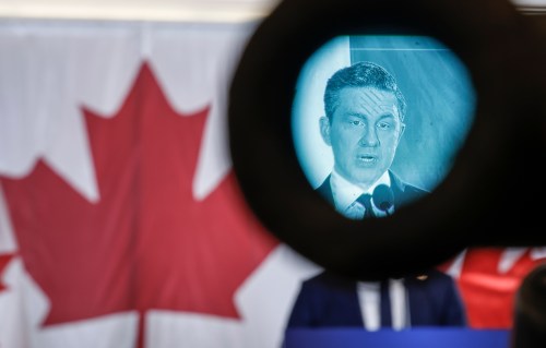 Conservative Leader Pierre Poilievre is seen in the viewfinder of a television camera while speaking at a news conference in Calgary on Wednesday, Nov. 12, 2025. THE CANADIAN PRESS/Jeff McIntosh
