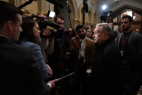 Finance Minister François-Philippe Champagne speaks with reporters before cabinet on Parliament Hill in Ottawa, Tuesday, April 21, 2026. THE CANADIAN PRESS/Adrian Wyld