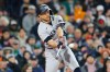 New York Yankees' Giancarlo Stanton hits a two-run double during the sixth inning of a baseball game against the Boston Red Sox, on Tuesday, April 21, 2026, in Boston. (AP Photo/CJ Gunther)
