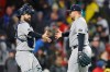 New York Yankees catcher Austin Wells, left, greets New York Yankees pitcher David Bednar, after the New York Yankees defeated the Boston Red Sox in a baseball game, on Tuesday, April 21, 2026, in Boston. (AP Photo/CJ Gunther)