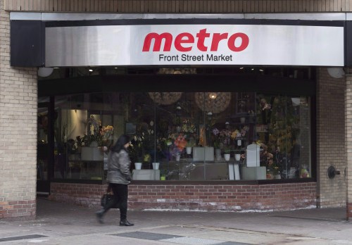 A woman walks pass a Metro grocery store in Toronto on Wednesday Nov. 1, 2017. THE CANADIAN PRESS/Doug Ives