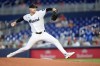 Miami Marlins starting pitcher Janson Junk pitches during the first inning of a baseball game against the St. Louis Cardinals, Wednesday, April 22, 2026, in Miami. (AP Photo/Rebecca Blackwell)