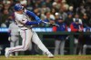 Texas Rangers' Wyatt Langford hits a single against the Seattle Mariners during the seventh inning of a baseball game, Friday, April 17, 2026, in Seattle. (AP Photo/Lindsey Wasson)