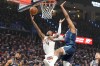 Phoenix Suns guard Jalen Green, left, shoots in front of Oklahoma City Thunder guard Jalen Williams during the first half in Game 2 of a first-round NBA playoffs basketball series Wednesay, April 22, 2026, in Oklahoma City. (AP Photo/Kyle Phillips)