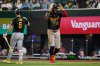 Pittsburgh Pirates' Oneil Cruz celebrates his three-run home run with Brandon Lowe (5) in the ninth inning of a baseball game against the Texas Rangers Wednesday, April 22, 2026, in Arlington, Texas. (AP Photo/Tony Gutierrez)