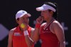 Japan's Eri Hozumi, right, and teammate Shuko Aoyama talk tactics during a doubles match between Italy's Jasmine Paolini and Sara Errani against Japan's Eri Hozumi and Shuko Aoyama, during a Billy Jean King Cup match between Italy and Japan, in Velletri, Italy, Saturday, April 11, 2026. (Alfredo Falcone/LaPresse via AP)