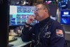 Specialist Anthony Matesic works the floor of the New York Stock Exchange, Thursday, April 23, 2026. (AP Photo/Richard Drew)