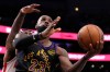 Los Angeles Lakers forward LeBron James, right, shoots as Houston Rockets forward Tari Eason defends during the second half in Game 2 of a first-round NBA playoffs basketball series Tuesday, April 21, 2026, in Los Angeles. (AP Photo/Mark J. Terrill)