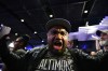 A Baltimore Ravens fan reacts to the team's first overall draft selection of guard Olaivavega Ioane during an NFL football draft party at M&T Bank Stadium in Baltimore, Thursday, April 23, 2026. (AP Photo/Stephanie Scarbrough)