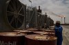 FILE - A worker collects engine oil as he works at a degassing station at Zubair oil field near Basra, Iraq, March 28, 2026. (AP Photo/Leo Correa, File)