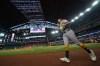 Athletics' Nick Kurtz runs to the dugout after hitting a leadoff home run on the first pitch from Texas Rangers starting pitcher Nathan Eovaldi during the first inning of a baseball game Friday, April 24, 2026, in Arlington, Texas. (AP Photo/Julio Cortez)
