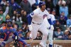 Chicago Cubs' Michael Conforto runs after hitting a one-run double during the ninth inning of a baseball game against the New York Mets in Chicago, Sunday, April 19, 2026. (AP Photo/Nam Y. Huh)