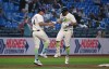 Tampa Bay Rays third base coach Brady Williams (4) and Jonathan Aranda, right, celebrate after Aranda's home run during the sixth inning of a baseball game against the Minnesota Twins, Friday, April 24, 2026, in St. Petersburg, Fla. (AP Photo/Jason Behnken)