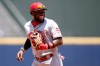 FILE - Cincinnati Reds second baseman Brandon Phillips (4) laughs as he runs off the field in the fifth inning of a baseball game against the Atlanta Braves, Thursday, June 16, 2016, in Atlanta. (AP Photo/Brett Davis, File)