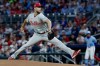 Philadelphia Phillies starting pitcher Zack Wheeler (45) delivers to an Atlanta Braves batter during the first inning of a baseball game, Saturday, April 25, 2026, in Atlanta. (AP Photo/Erik S. Lesser)