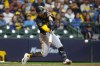 Pittsburgh Pirates' Nick Gonzales hits a two-RBI single during the 10th inning of a baseball game against the Milwaukee Brewers, Saturday, April 25, 2026, in Milwaukee. (AP Photo/Jeffrey Phelps)