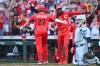Cincinnati Reds' Sal Stewart, left, celebrates after his three-run home run with teammate Elly de la Cruz, second from left, during the first inning of a baseball game against the Detroit Tigers in Cincinnati, Saturday, April 25, 2026. (AP Photo/Ben Jackson)