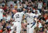 New York Yankees' Trent Grisham (12) celebrates after his home run with Aaron Judge, right, during the third inning of a baseball game against the Houston Astros, Saturday, April 25, 2026, in Houston. (AP Photo/Karen Warren)