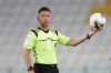 FILE - Referee Gianluca Rocchi holds the ball during a Serie A soccer match between Juventus and Roma, at the Allianz stadium in Turin, Italy, Saturday, Aug.1, 2020. (AP Photo/Luca Bruno, File)