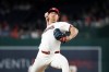 Washington Nationals pitcher Clayton Beeter throws during the ninth inning of a baseball game against the Atlanta Braves, Tuesday, April 21, 2026, in Washington. (AP Photo/Terrance Williams)