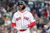 Boston Red Sox's Trevor Story runs to the dug out after scoring during the second inning of a baseball game against the New York Yankees, Thursday, April 23, 2026, in Boston. (AP Photo/Mark Stockwell)