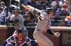 Colorado Rockies' Jake McCarthy looks after an RBI single during the seventh inning of the first baseball game of a doubleheader against the New York Mets, Sunday, April 26, 2026, in New York. (AP Photo/Seth Wenig)