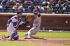 Colorado Rockies' Brett Sullivan (26), right, slides safely home while New York Mets catcher Luis Torrens waits for the ball during the seventh inning of the first baseball game of a doubleheader, Sunday, April 26, 2026, in New York. (AP Photo/Seth Wenig)