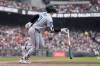 Miami Marlins' Graham Pauley watches his three-run home run against the San Francisco Giants during the second inning of a baseball game Sunday, April 26, 2026, in San Francisco. (AP Photo/Jeff Chiu)