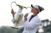Nelly Korda poses with the trophy after winning the Chevron Championship LPGA golf tournament Sunday, April 26, 2026, in Houston. (AP Photo/Ashley Landis)