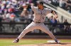 Colorado Rockies pitcher Jose Quintana throws during the third inning of the first baseball game of a doubleheader against the New York Mets, Sunday, April 26, 2026, in New York. (AP Photo/Seth Wenig)
