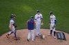 New York Mets pitcher Kodai Senga, second from right, is pulled from the game during the third inning of the second baseball game of a doubleheader against the Colorado Rockies, Sunday, April 26, 2026, in New York. (AP Photo/Seth Wenig)