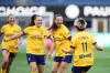 Utah Royals forward Paige Cronin (4) celebrates her goal against the Seattle Reign FC with midfielder Janni Thomsen (7) and forward Mina Tanaka (11) during the first half of an NWSL soccer match, Sunday, April 26, 2026, in Seattle. (AP Photo/Lindsey Wasson)