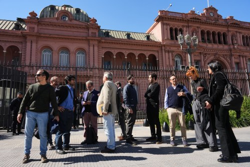 Journalists stand outside of the Casa Rosada government headquarters after President Javier Milei blocked their access, in Buenos Aires, Argentina, Thursday, April 23, 2026. (AP Photo/Rodrigo Abd)