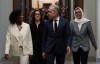 Prime Minister Mark Carney walks to caucus with MP for Terrebonne Tatiana Auguste, MP for University-Rosedale Danielle Martin and MP for Scarborough Southwest Doly Begum on Parliament Hill in Ottawa on Wednesday, April 15, 2026. THE CANADIAN PRESS/Adrian Wyld