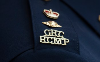 An RCMP logo is seen on the shoulder of a superintendent during a news conference in St. John's, N.L., on Saturday, June 24, 2023. THE CANADIAN PRESS/Adrian Wyld