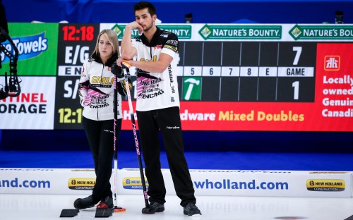 Team Sahaidak/Lott skip Kadriana Sahaidak, left, and third Colton Lott discuss strategy while playing Team Einarson/Gushue during the Canadian Mixed Doubles Curling Championship final in Calgary, Alta., Thursday, March 25, 2021.THE CANADIAN PRESS/Jeff McIntosh