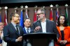 NDP Leader Avi Lewis, left, looks toward NDP MP Alexandre Boulerice, centre, as he responds to a reporter's question during a press conference on Parliament Hill in Ottawa on Monday, April 13, 2026. THE CANADIAN PRESS/Sean Kilpatrick