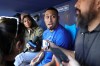 Los Angeles Dodgers relief pitcher Edwin Diaz, center, gives interviews before a baseball game against the Miami Marlins, Monday, April 27, 2026, in Los Angeles. (AP Photo/Ryan Sun)