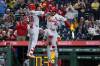 St. Louis Cardinals' JJ Wetherholt (26) celebrates with Iván Herrera (48) on his way back to the dugout after his home run off of Pittsburgh Pirates pitcher Dennis Santana in the ninth inning of a baseball game, in Pittsburgh, Monday, April 27, 2026. (AP Photo/Tom E. Puskar)