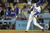 Los Angeles Dodgers designated hitter Shohei Ohtani hits an RBI ground-rule double to score Andy Pages during the ninth inning of a baseball game against the Miami Marlins Monday, April 27, 2026, in Los Angeles. (AP Photo/Ryan Sun)