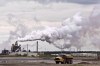 A dump truck works near the Syncrude oilsands extraction facility near the city of Fort McMurray, Alberta on Sunday June 1, 2014. THE CANADIAN PRESS/Jason Franson
