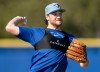 Toronto Blue Jays pitcher Trey Yesavage makes a throw to first base during a drill at spring training in Dunedin, Fla., on Feb. 16, 2026. THE CANADIAN PRESS/Frank Gunn