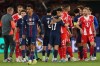 Bayern's Luis Diaz, center right, and PSG's Vitinha embrace at the end of a Champions League semifinal, first leg, soccer match between Paris Saint-Germain and Bayern Munich in Paris, Tuesday, April 28, 2026. (AP Photo/Aurelien Morissard)
