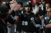 Chicago White Sox' Everson Pereira (28) celebrates with teammates after hitting an RBI sacrifice fly out against the Arizona Diamondbacks in the first inning of a baseball game, Tuesday, April 21, 2026, in Phoenix. (AP Photo/Rick Scuteri)