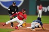Tampa Bay Rays' Taylor Walls, right, steals second base as the throw gets past Cleveland Guardians shortstop Brayan Rocchio, left, in the ninth inning of a baseball game in Cleveland, Tuesday, April 28, 2026. (AP Photo/Sue Ogrocki)